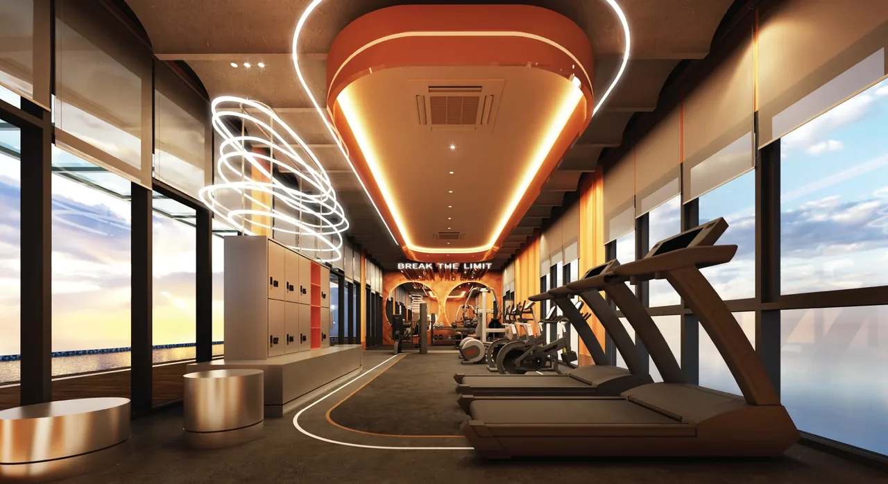 Full-height glazed fitness studio with treadmills and sea view