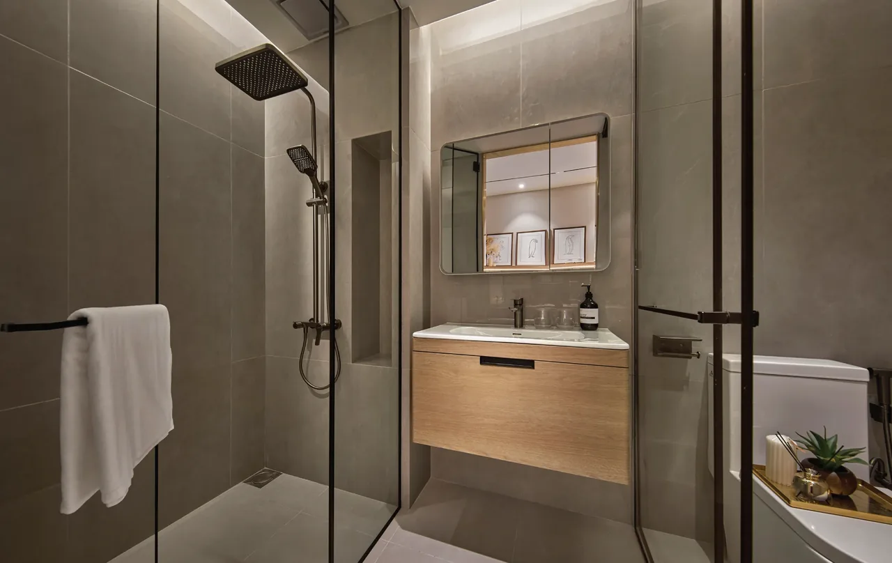 Rain shower bathroom with wall-hung vanity and frameless glass partition